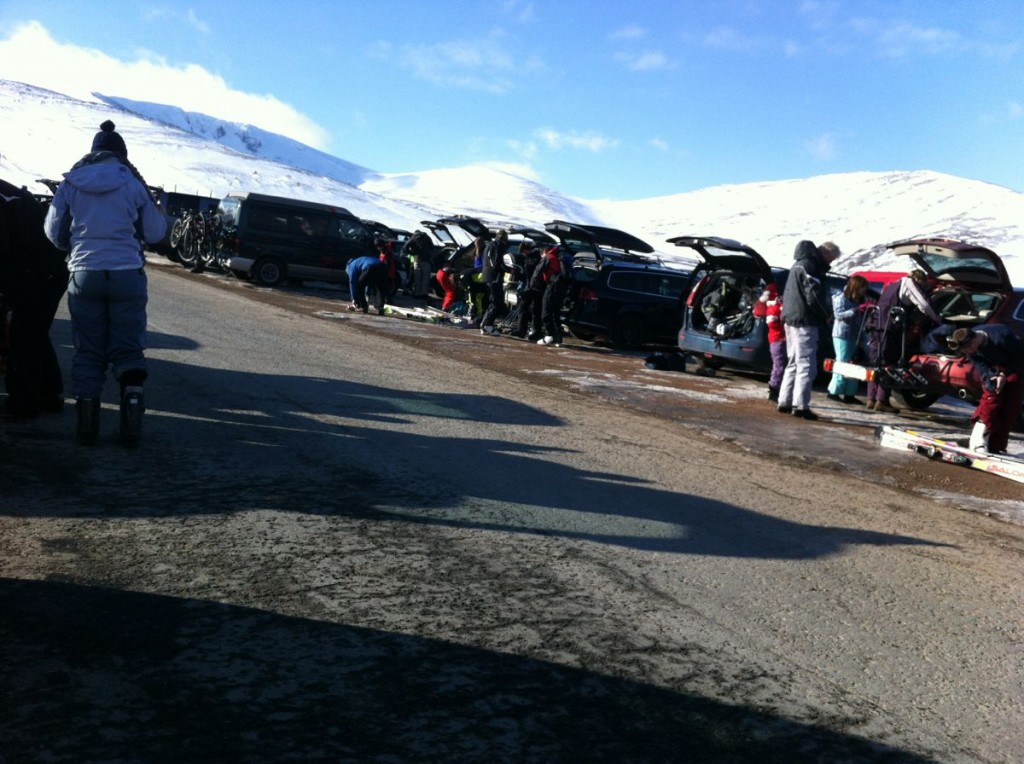 A collection of skiers in the car park