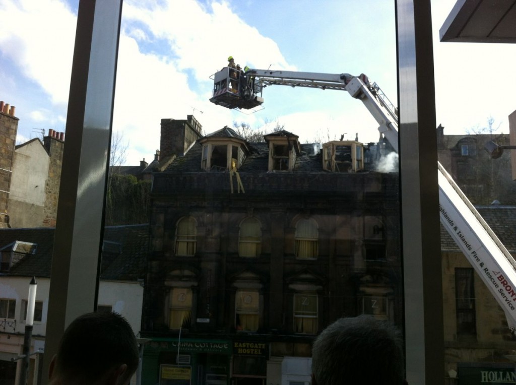 Fire brigade dousing buildings near the shopping centre